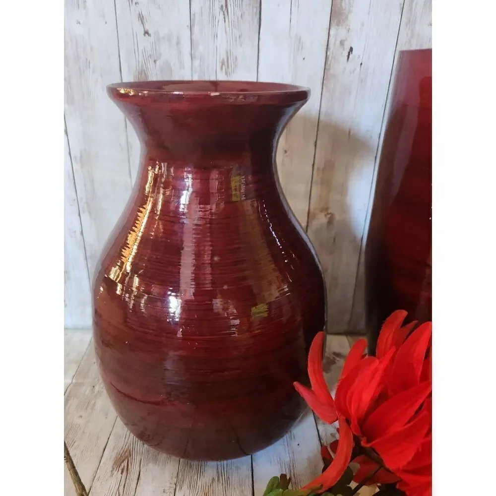 Large red decorative lacquerware vace and flowers